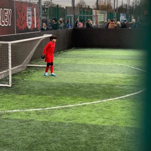 a child standing in goal
